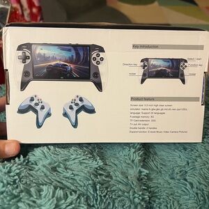 Portable Gaming Console with Dual Controllers - Black and White